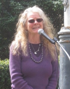 Sue Barnhart speaking into a microphone