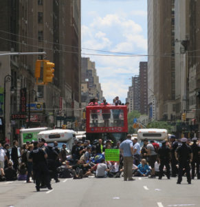 Demonstrators block 8th Avenue in Manhattan