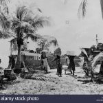 People of Bikini Atoll carry their possessions to ships as part of forced relocation