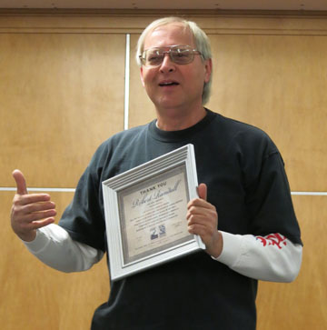 Robert Randall with his award
