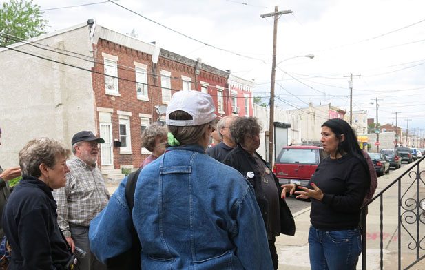 Cheri Honkala (right) talks to the assembled war tax resisters during our tour of Kensington.